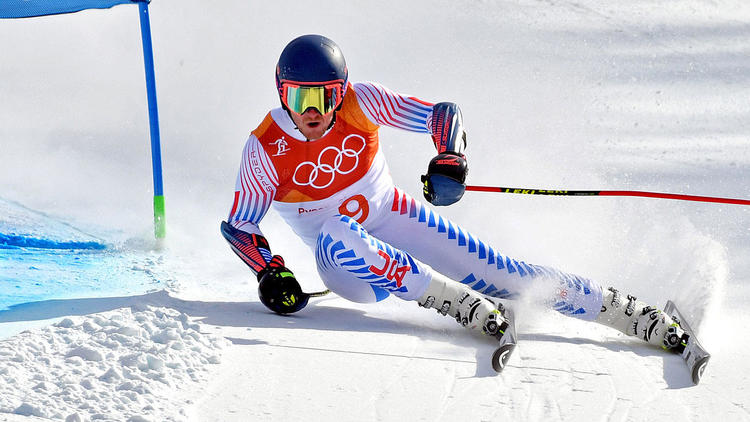 Male skier racing on Head skis and boots in the Olympics