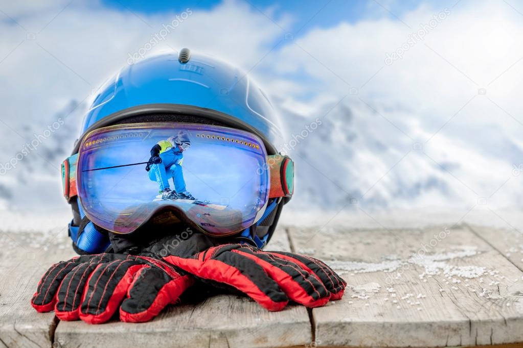 Essential ski rental items including helmets, socks, and goggles ready for pickup