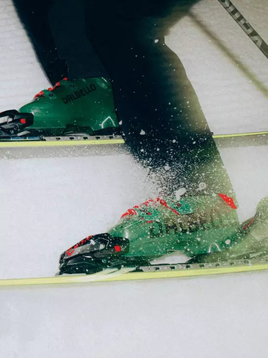 Green Dalbello Ski Boot on Yellow Race Skis