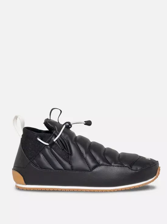 Black quilted Line Boot with white laces on a light gray background