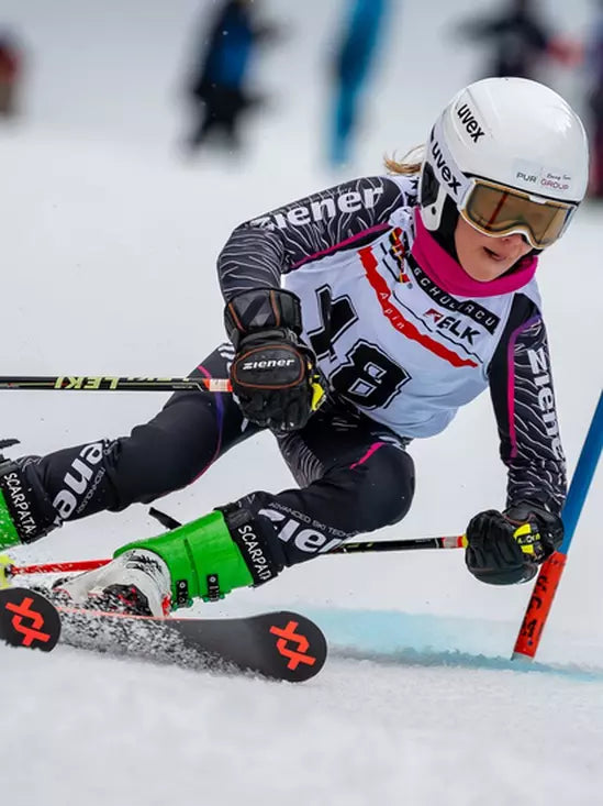 Volkl Racetiger GS R JR Skis 2026 Skier with Dalbello Boots