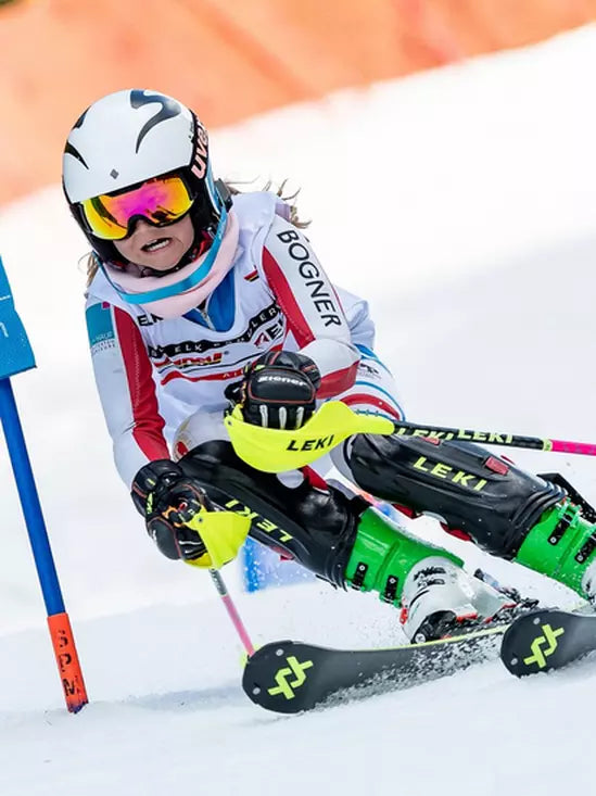 Volkl Racetiger SL R JR Skis 2026 Skier with Dalbello Boots