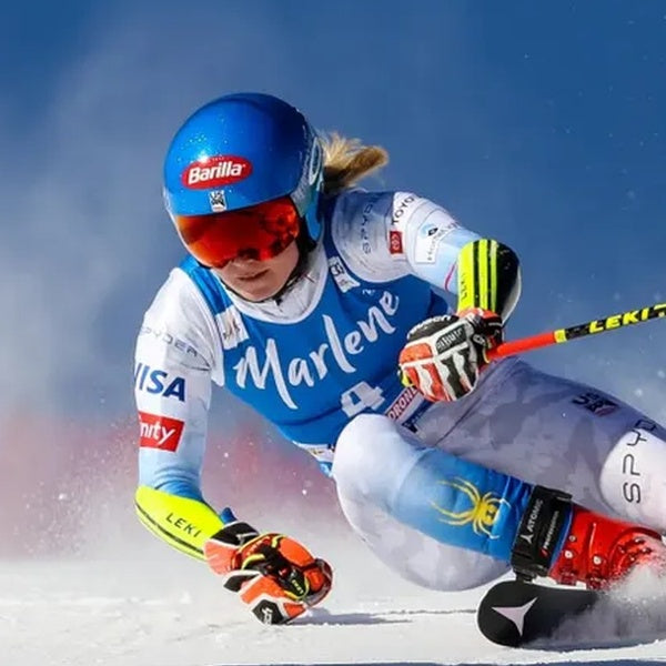 Female Ski racer with blue helmet